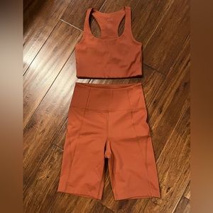 Girlfriend Collective Athletic Shorts in Rust Orange